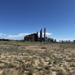 A photograph of blue skies over a closed coal power plant